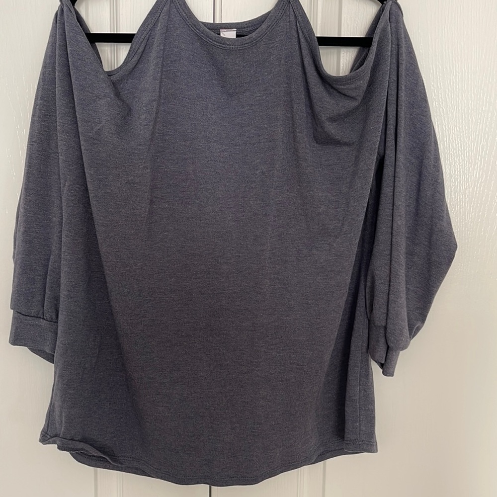 Flowy sweater top with open shoulder design